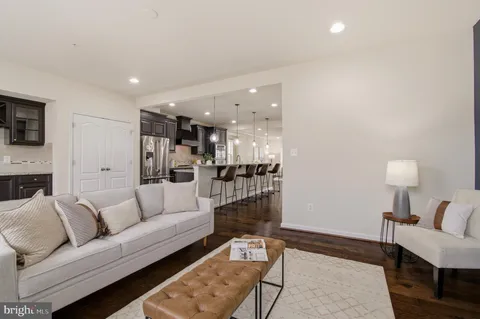 a view of dining room with furniture and wooden floor
