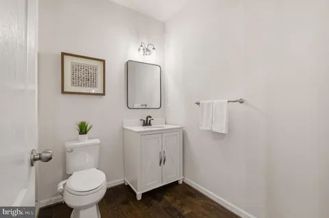 a bathroom with a granite countertop sink mirror and shower