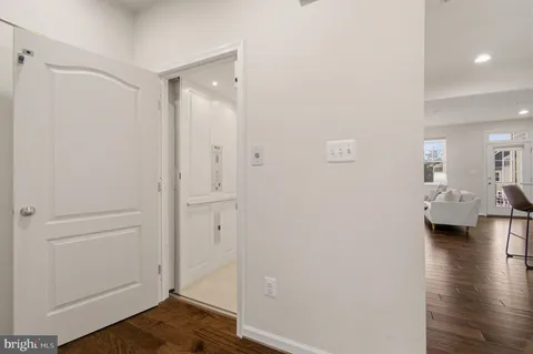 a view of a house with wooden fence