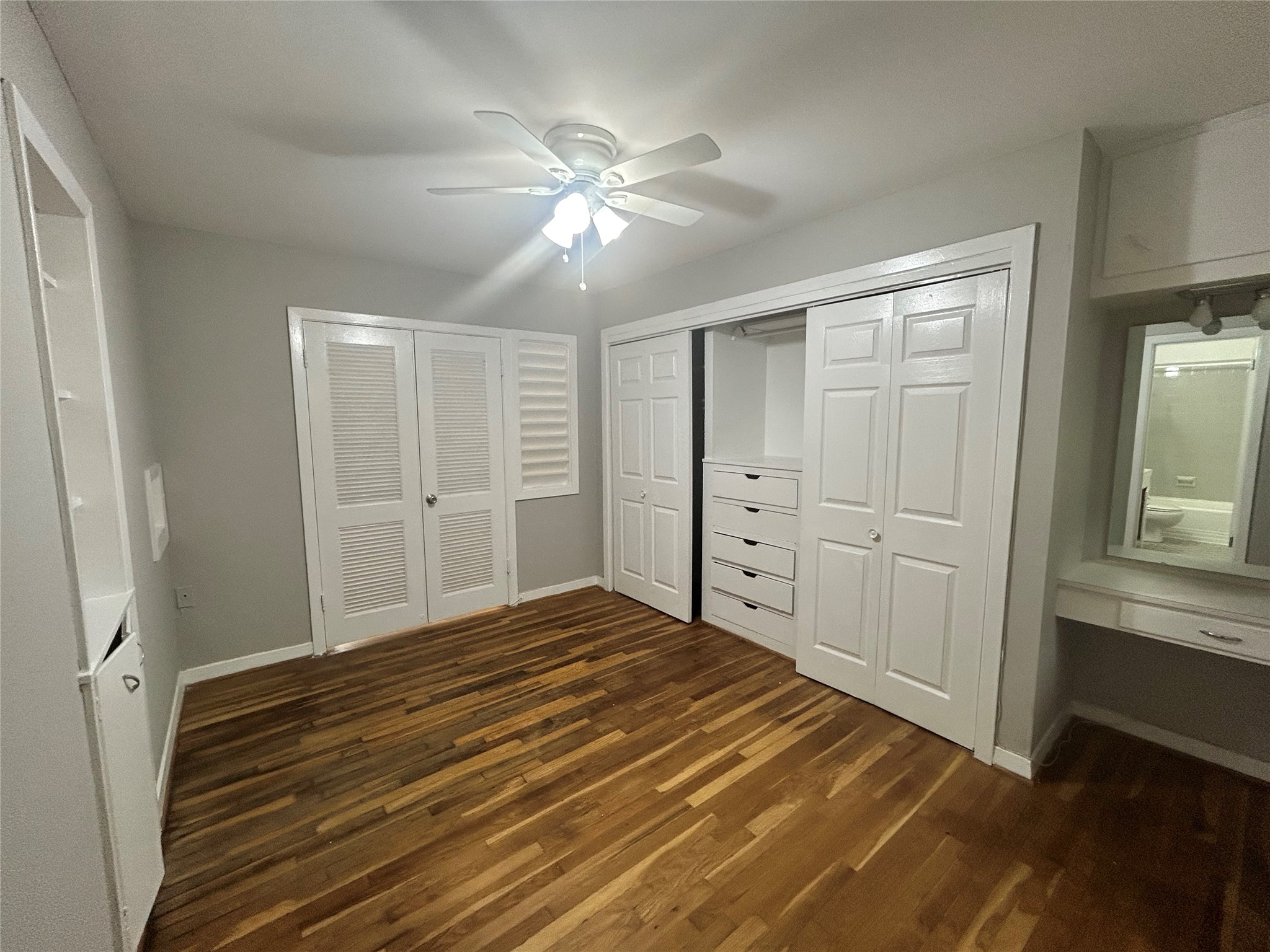 3520 Garrott Street, Unit 3 Houston, TX 77006 - Photo 7 of 12 a bedroom with a bed and a chandelier