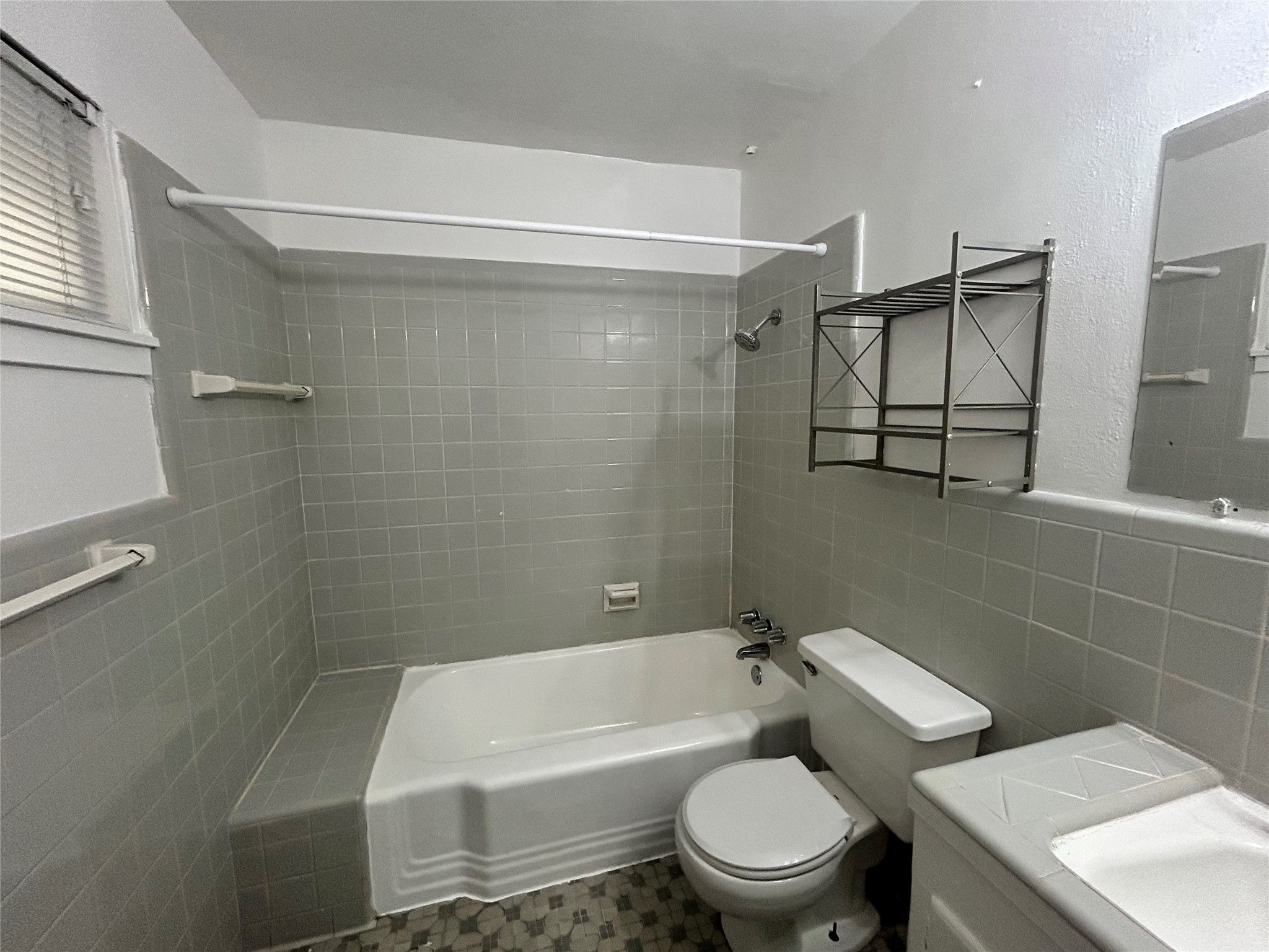 3520 Garrott Street, Unit 3 Houston, TX 77006 - Photo 9 of 12 a bathroom with a toilet a sink and bathtub
