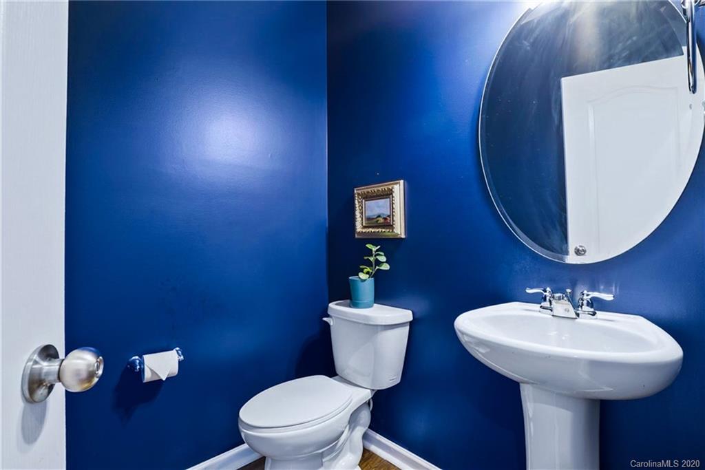 210 Hampton Trail Drive Fort Mill, SC 29708 - Photo 13 of 24 a bathroom with a toilet a sink and mirror