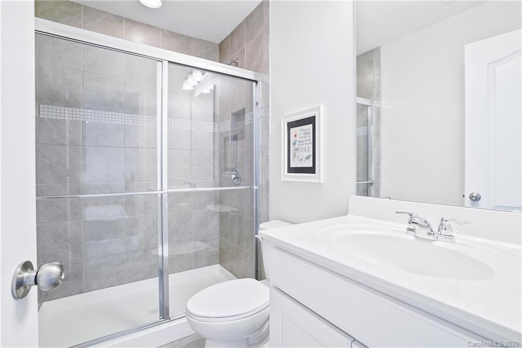 210 Hampton Trail Drive Fort Mill, SC 29708 - Photo 18 of 24 a bathroom with a sink toilet and shower