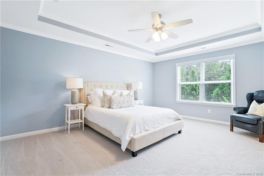 210 Hampton Trail Drive Fort Mill, SC 29708 - Photo 21 of 24 a bedroom with a bed and a ceiling fan
