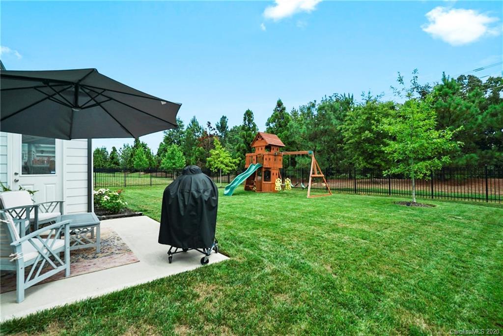 210 Hampton Trail Drive Fort Mill, SC 29708 - Photo 24 of 24 a view of a table and chairs under an umbrella