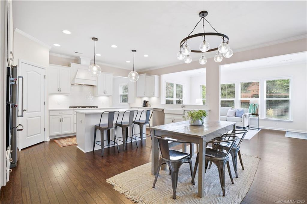 210 Hampton Trail Drive Fort Mill, SC 29708 - Photo 5 of 24 a view of a dining room with furniture window and wooden floor