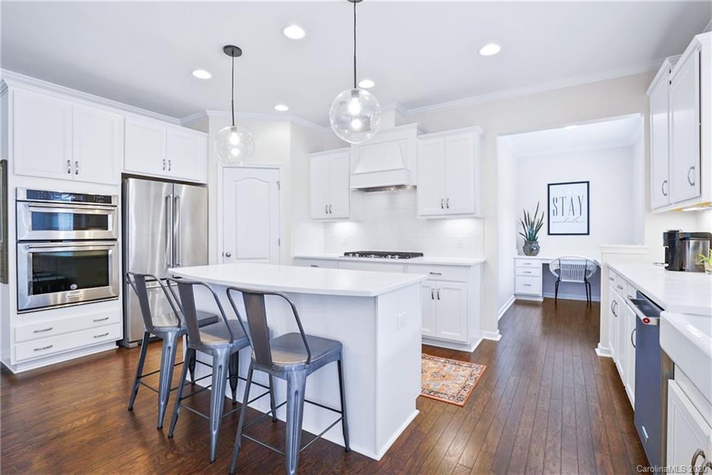210 Hampton Trail Drive Fort Mill, SC 29708 - Photo 6 of 24 a large kitchen with a table and chairs in it