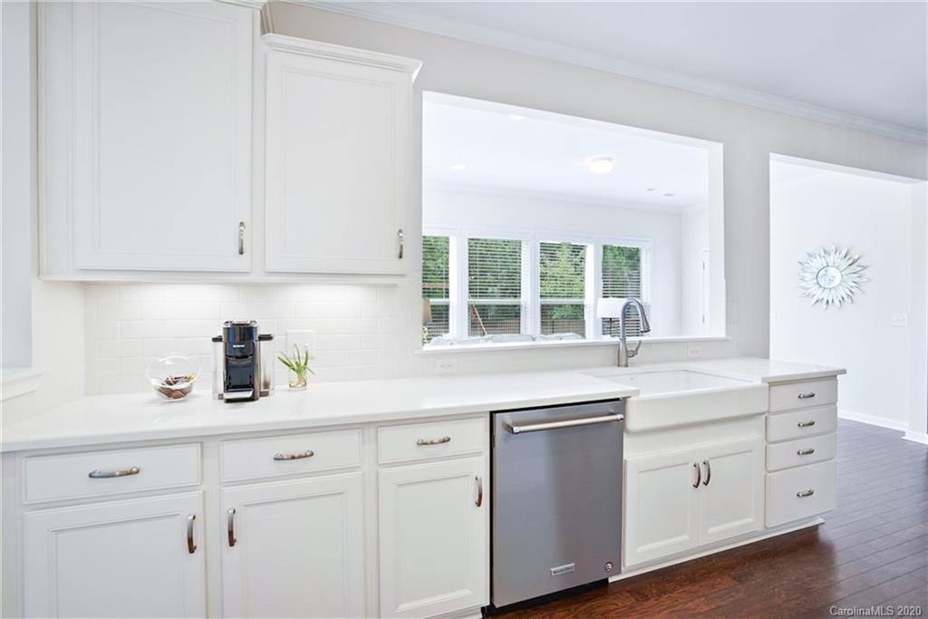 210 Hampton Trail Drive Fort Mill, SC 29708 - Photo 7 of 24 a kitchen with white cabinets and a window