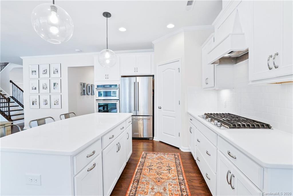 210 Hampton Trail Drive Fort Mill, SC 29708 - Photo 8 of 24 a kitchen with white cabinets and appliances
