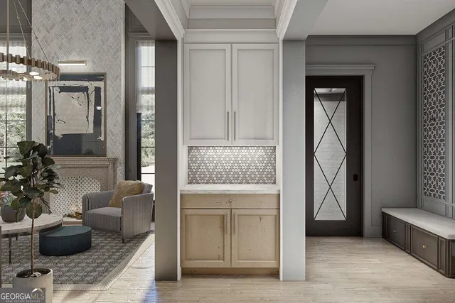 a living room with furniture a chandelier and a fireplace