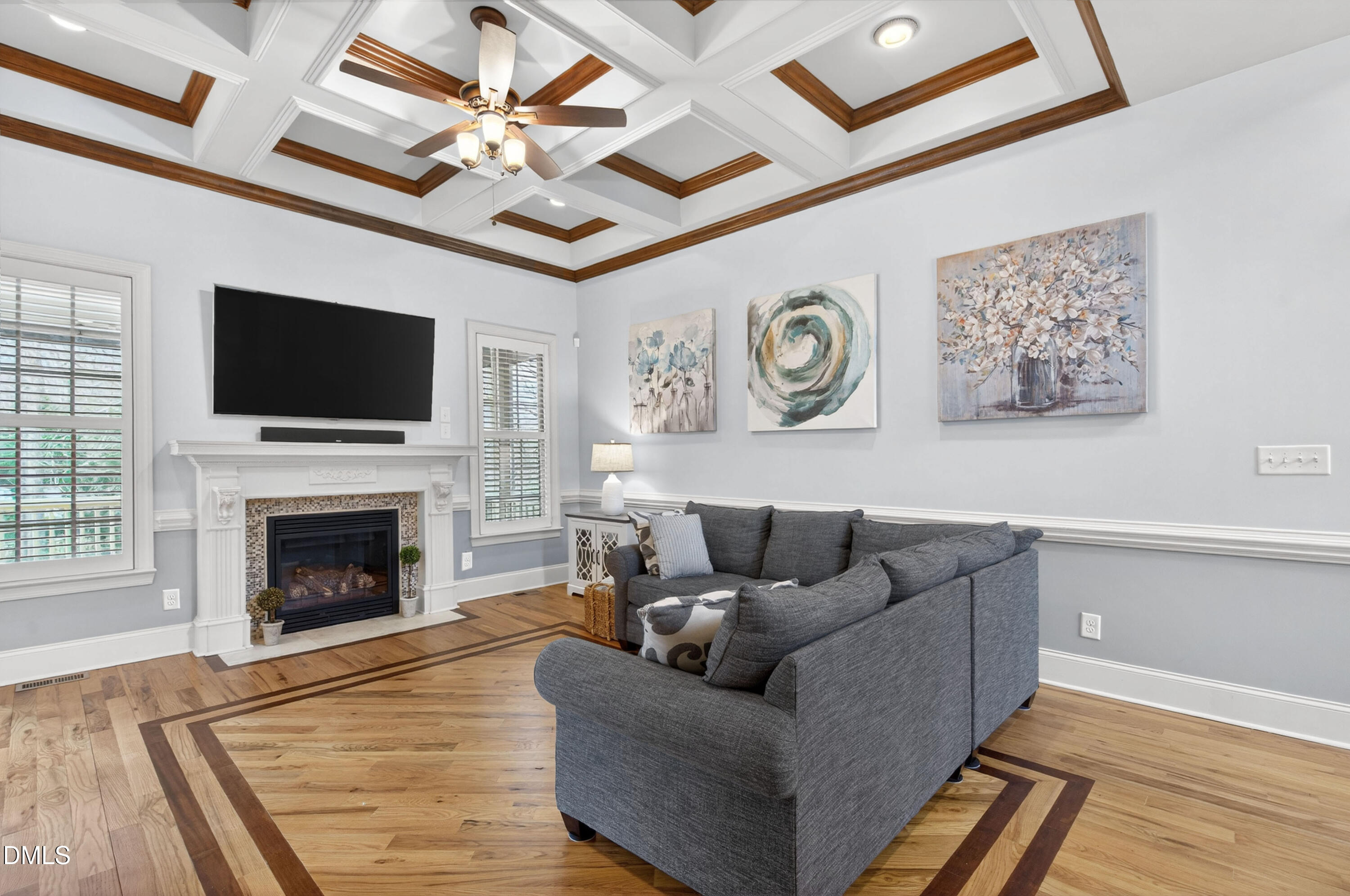 691 Hawthorne Place Creedmoor, NC 27522 - Photo 14 of 84 a living room with furniture a flat screen tv and a fireplace