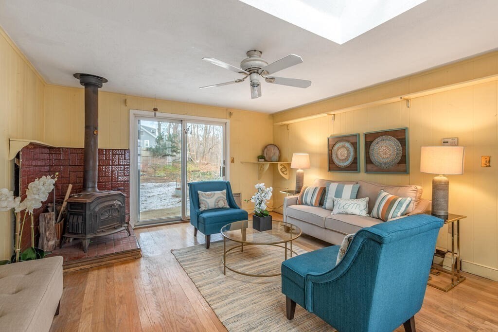 20 Argilla Road Ipswich, MA 01938 - Photo 11 of 33 a living room with furniture and a floor to ceiling window