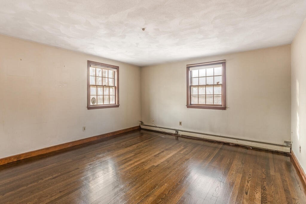 20 Argilla Road Ipswich, MA 01938 - Photo 22 of 33 an empty room with wooden floor and windows