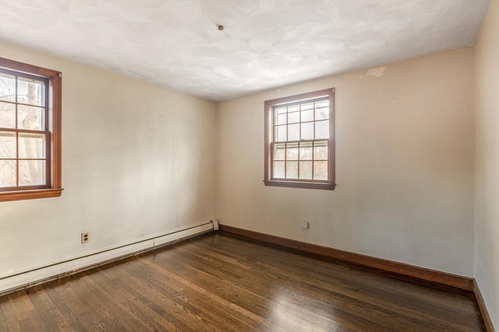 20 Argilla Road Ipswich, MA 01938 - Photo 23 of 33 an empty room with wooden floor and windows