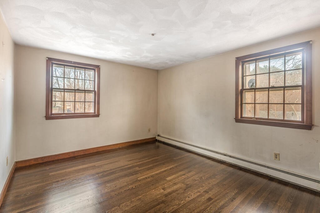 20 Argilla Road Ipswich, MA 01938 - Photo 24 of 33 a view of an empty room with wooden floor and a window
