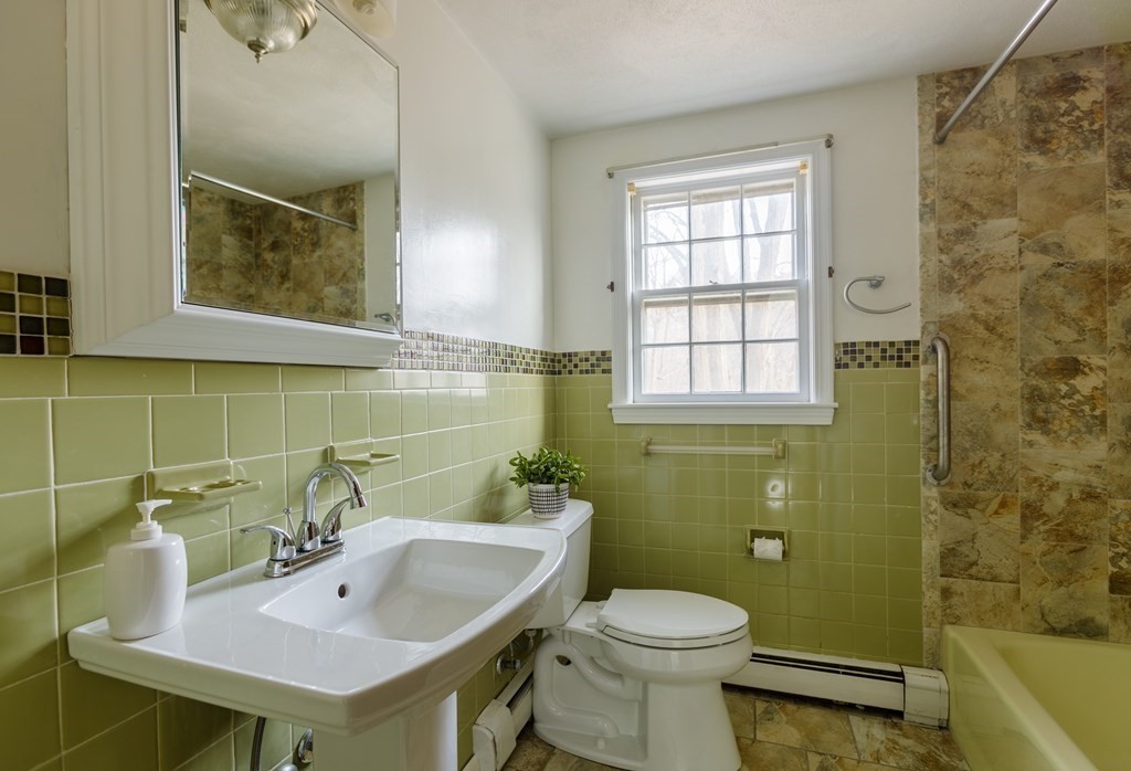 20 Argilla Road Ipswich, MA 01938 - Photo 25 of 33 a bathroom with a sink a toilet and bathtub