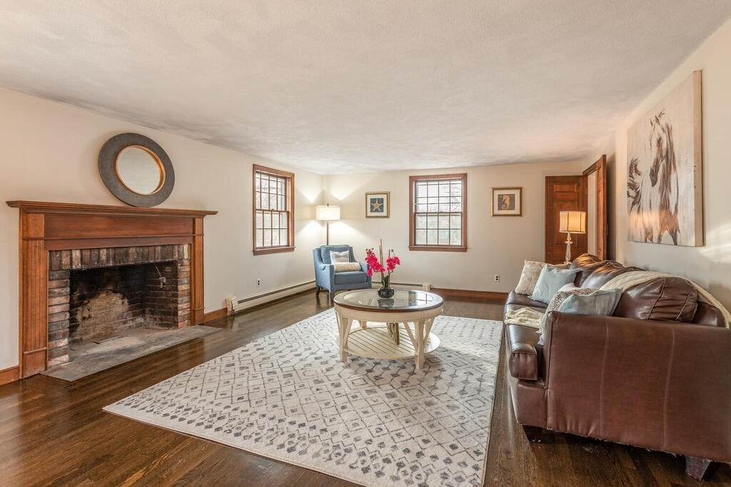 20 Argilla Road Ipswich, MA 01938 - Photo 4 of 33 a living room with furniture a rug and a fireplace