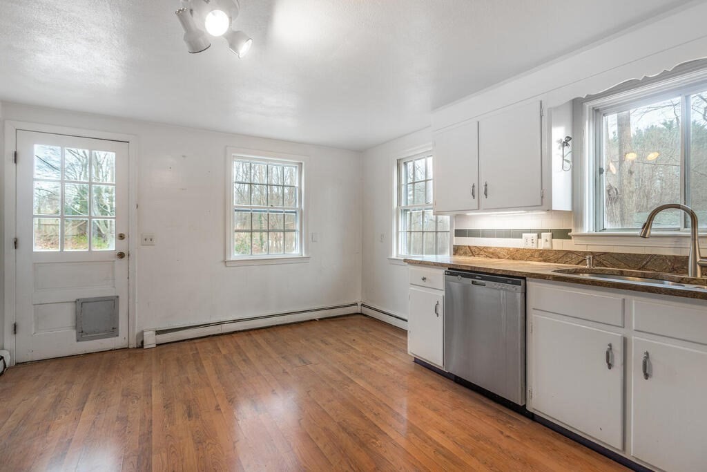 20 Argilla Road Ipswich, MA 01938 - Photo 8 of 33 a view of kitchen with granite countertop cabinets and wooden floor
