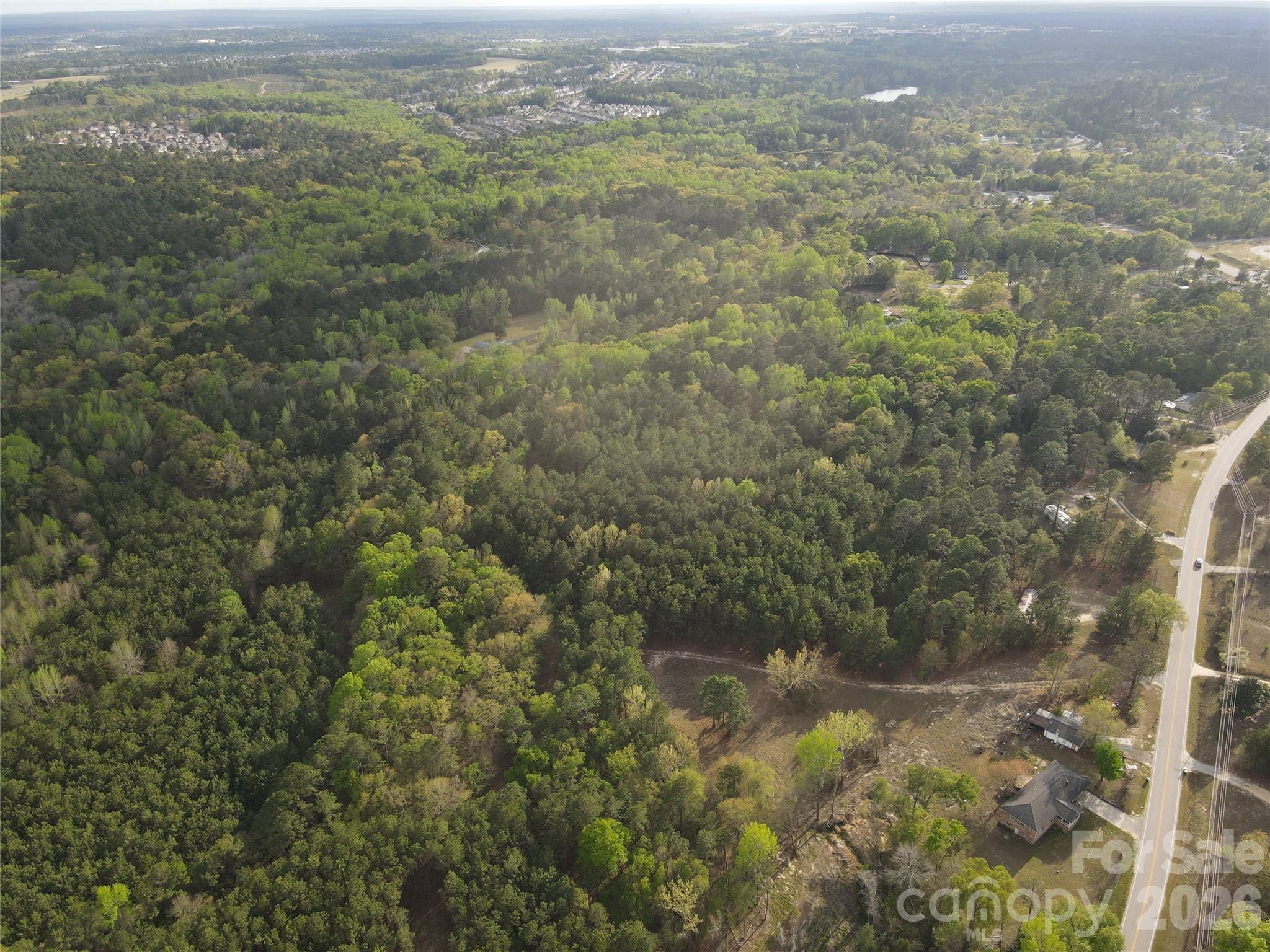 0 Kelly Mill Road Elgin, SC 29045 - Photo 7 of 17 a view of a city with lush green forest