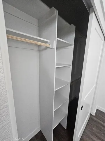 a bathroom with a sink toilet vanity and shower