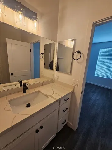 a bathroom with a sink and a microwave