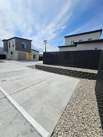 a view of a house with a yard and garage