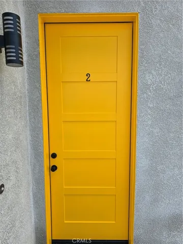 a kitchen with stainless steel appliances and white cabinets