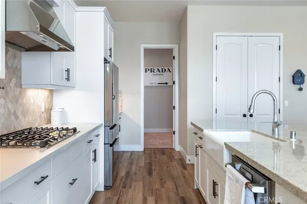 a kitchen with a sink stove and refrigerator