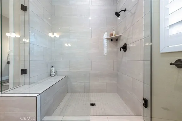a bathroom with a bathtub and shower