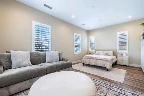 a bedroom with furniture and a couch