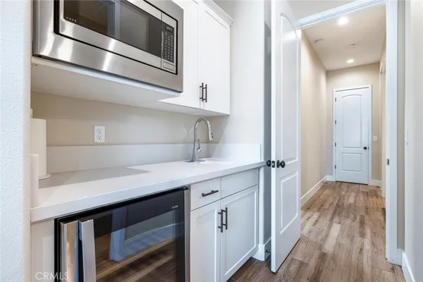 a kitchen with a sink and cabinets
