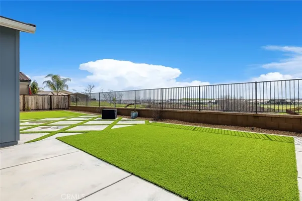 a view of a swimming pool with lawn chairs