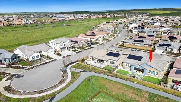 an aerial view of a house with outdoor space