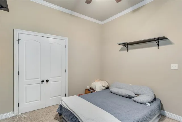 a bedroom with a bed and cabinets