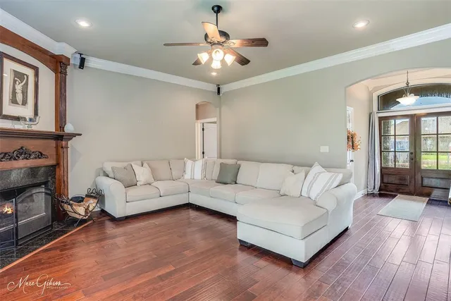 a living room with furniture and a fireplace
