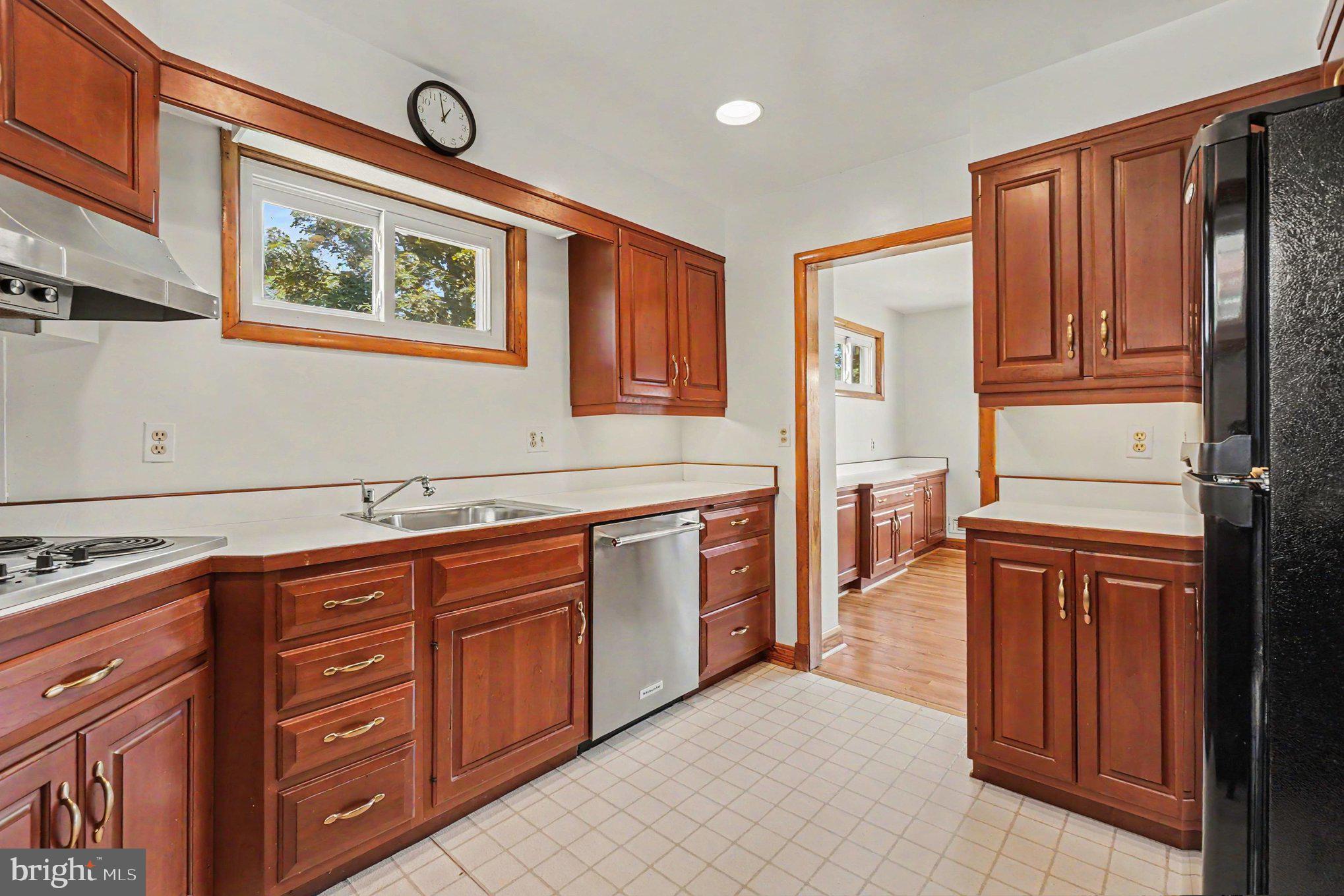9204 Snyder Lane Perry Hall, MD 21128 - Photo 12 of 42 a kitchen with stainless steel appliances granite countertop a refrigerator and a stove top oven