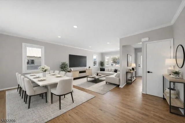 a view of a livingroom with furniture and a flat screen tv