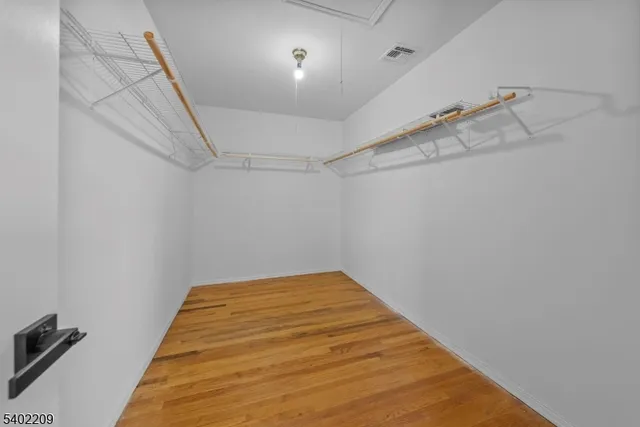 a view of a room with racks on the wall