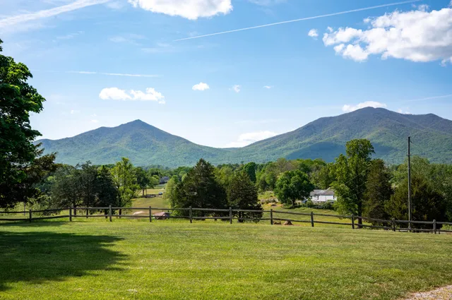 a view of a house with a big yard