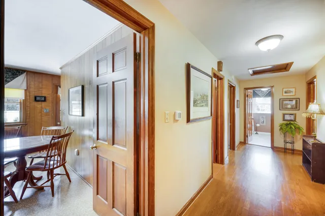 a bathroom with a granite countertop sink a toilet and a large mirror
