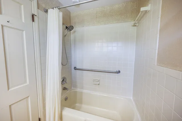 a view of entryway livingroom and hall with wooden floor