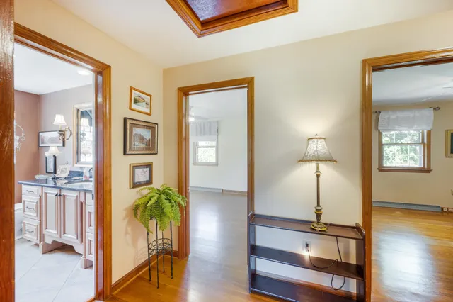 a living room with fireplace furniture and a fireplace
