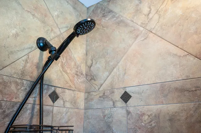 a view of an empty room with a ceiling fan