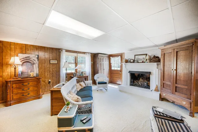 a view of a bench in the garden near a lake