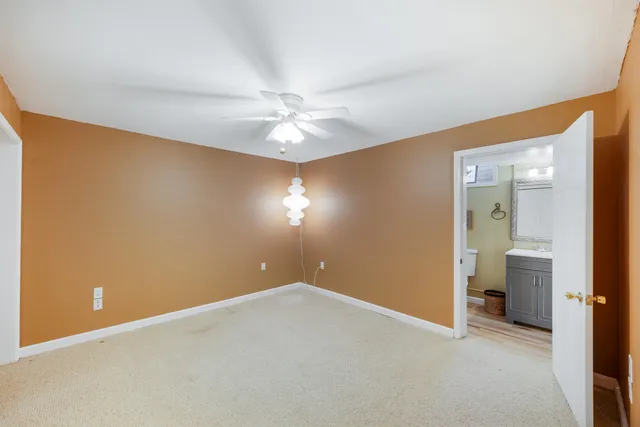 a view of a lush green hillside and a houses