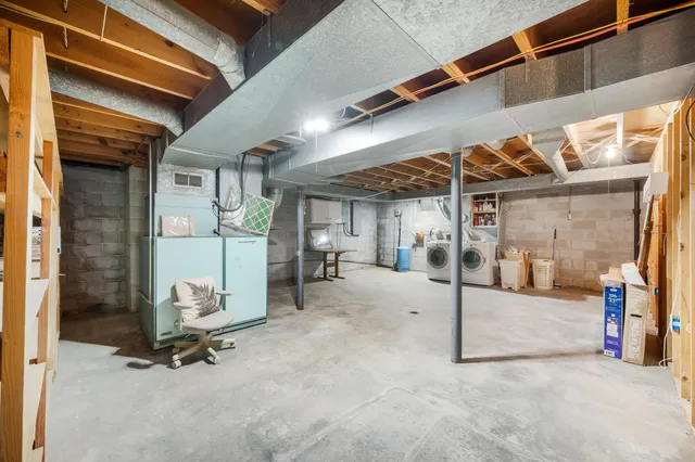 a view of an house with backyard and tree