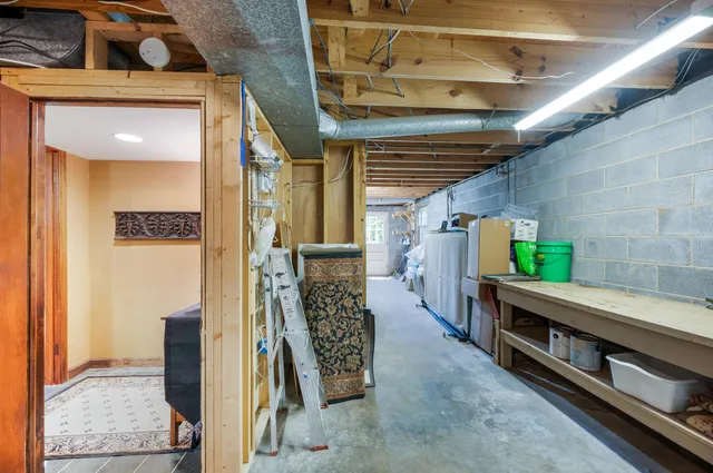 a front view of a house with a garden and plants
