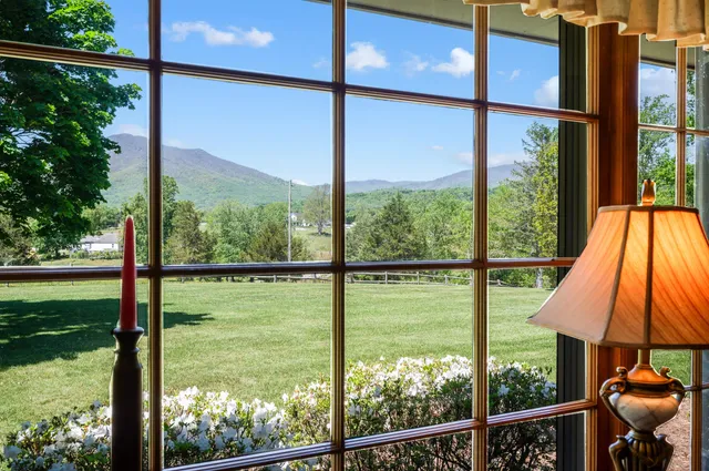 a kitchen with stainless steel appliances granite countertop a sink and a refrigerator