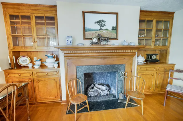 a kitchen with stainless steel appliances granite countertop a refrigerator a sink and white cabinets