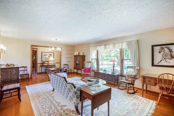 a kitchen with stainless steel appliances granite countertop a refrigerator and a cabinets